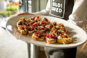 Platter of food being served by a Silo and Shed waiter